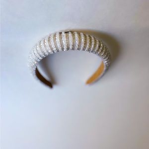 White handmade padded headband with beaded embellishments